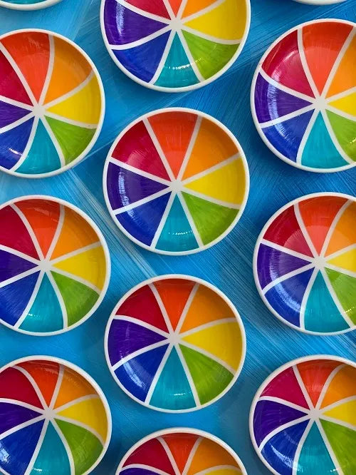 Group of color wheel rainbow trinket dishes in a row