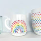 Vintage-style Rainbow Dot textured Teacup on white shelf. Made by Camille Gerrick.